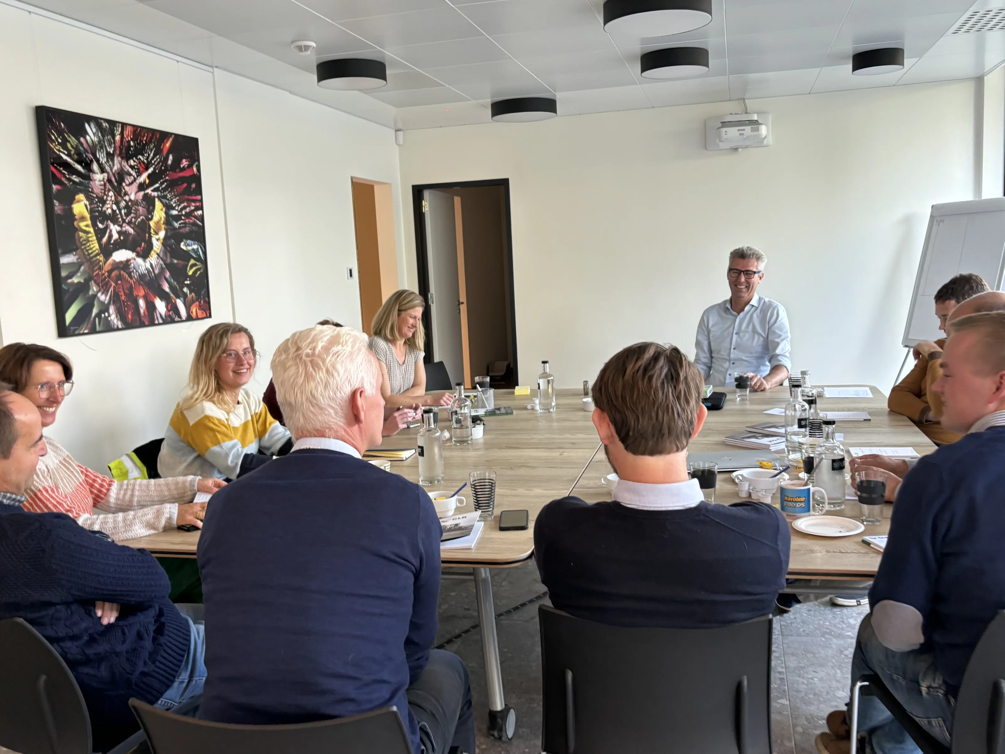 A facilitator in conversation with participants during a group session